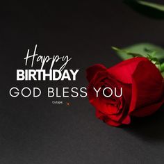 a red rose sitting on top of a black table next to the words happy birthday god