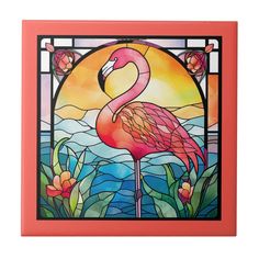 a pink flamingo standing in front of a stained glass window