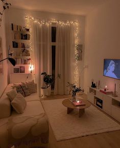 a living room filled with furniture and a flat screen tv