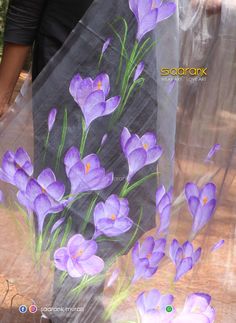 purple flowers painted on the side of a plastic sheet