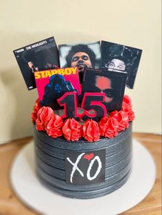 a birthday cake decorated with pictures and flowers