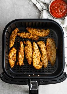 grilled chicken wings in an air fryer with ketchup on the side