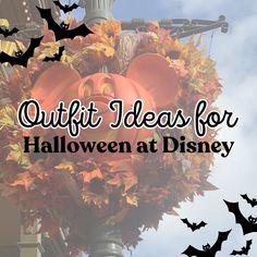 a bunch of pumpkins and bats hanging from a light pole with the words quiltt ideas for halloween at disney