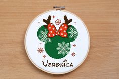 a cross stitch pattern with the name vernica on it and two minnie mouse heads