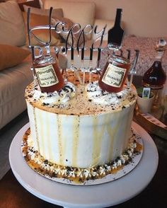 there is a cake that has two bottles on it