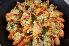 cooked shrimp with herbs in a skillet on the stove or counter top, ready to be eaten