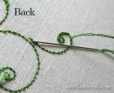 the stitches are being sewn together with green thread