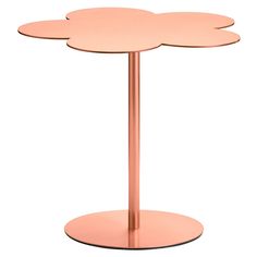 a pink table with three petals on it