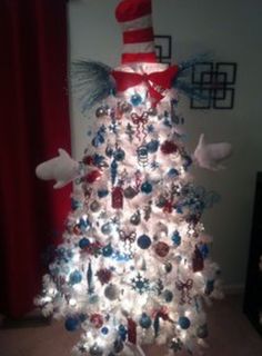 the cat in the hat christmas tree is decorated with blue, white and red ornaments