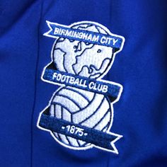 the birmingham city football club badge on a blue jacket