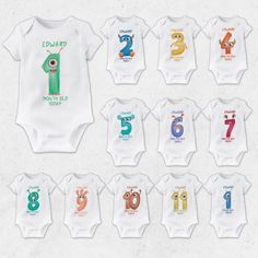 baby onesuits with numbers and characters on them in various colors, sizes and shapes