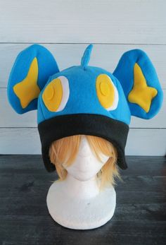 Shinx Pokemon Fleece Hat Novelty Costume Cap Hat, Novelty Cat Ears Costume Hat For Cosplay, Themed Adjustable Costume Hats For Cosplay, One Size Fits Most Costume Cap For Costume Party, Themed Cosplay Hat, One Size Fits Most, Themed Cosplay Hat, Novelty Costume Hat With Cat Ears, Themed Hats For Cosplay, One Size Fits Most, Winter Cosplay Costume Accessories With Ears