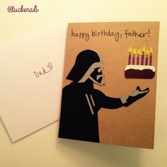 a card with a darth vader holding a birthday cake