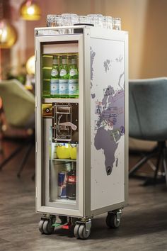 an open refrigerator with drinks in it on wheels