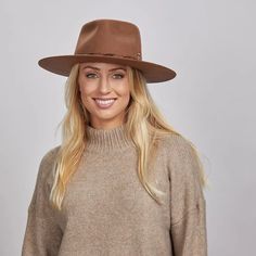 Aspen | Womens Wide Brim Felt Fedora Hat offers bold, rustic style with its Australian wool felt and unique leather band trim. Perfect for outdoor adventures with its 3 1/2" brim and distinctive brass and matchstick details. Material: Midweight 100% Australian Wool Felt Shape: Outback Trim: Leather Band Latch with Hemp Rope, Brass Safety Pin, and Matchstick Brim Size: 3 1/2" Crown hHeight: 4" Sweatband: AHM Velcro Imported Brown Flat Brim Boater Hat For Fall, Brown Wide Brim Boater Hat For Winter, Brown Boater Hat With Short Brim For Winter, Rustic Brown Hat Bands For Fall, Fall Outdoor Flat Cap, Brown Brimmed Boater Hat For Fall, Rustic Curved Brim Felt Hat For Winter, Rustic Brown Flat Brim Fedora, Brown Wide Brim Boater Hat For Fall