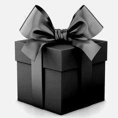 a black gift box with a large bow on it's top and the lid is open