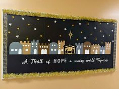 a bulletin board with a nativity scene on it