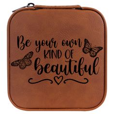 a brown leather case with butterflies and the words be your own kind of beautiful