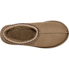 The UGG® Tasman is a casual women's suede slipper that can be worn indoors and outdoors. These UGG® Tasman Antilope Suede Women's Slippers have the following features: Suede upper Light, durable outsole You can wear it both indoors and out Lined with plush natural wool Crafted from soft suede with an embroidered braid and easy slip-on silhouette Sheepskin lining UGGpure wool insole Treadlite by UGG outsole Nylon binding 5955