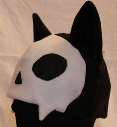 Ultrasoft fleece wolf hat with medium pointed freestanding 3D ears, black base with white skull pattern, soft "fangs", and stenciled eye and nose sockets.  PLEASE specify which base color is preferred. If choosing the Custom Colors option, please write your color choices in the "Personalization" field.  Perfect for outdoor winter fun, Halloween, or to make a statement. Will fit most adults. Wolf Fleece, Wolf Hat, Fleece Hat, Skull Pattern, Winter Fun, Base Colour, Color Choices, Custom Color, Caps Hats