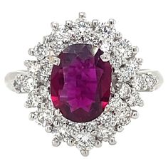 Classy and timeless, this beautiful 18k white Gold cluster ring features a 1.94 Carat oval-cut Ruby, origin Thailand, with a vibrant and rich purplish red color flanked by a double halo composed of sparkling Round Brilliant cut Diamonds for a total approx. weight of 1.50 carats color G Vvs clarity. The Ruby is accompanied by a gemological report nr. 18415 from CISGEM Gemological laboratory. Ring Size: US 7 - IT 14 - FR 54 - UK N/O This ring may be professionally adjusted in size on request to me Wedding Core, Cowry Shell, Double Halo, Ruby Diamond, Diamond Cluster Ring, Dream Jewelry, Diamond Cluster, Round Brilliant Cut Diamond, Cluster Ring