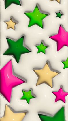 some green and pink stars on a white background