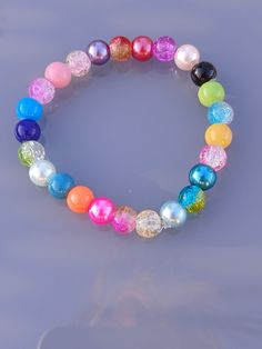 Random bead bracelet Size: 7 in Party Beaded Bracelets With Faceted Beads, Multicolor Polished Round Beads Bracelet, Multicolor Polished Beads Bracelet, Elegant Multicolor 8mm Beads Bracelets, Elegant Multicolor 8mm Beaded Bracelets, Colorful Round Beaded Bracelets For Party, Adjustable Pearl Bracelet With Colorful Beads, Multicolor Round Beaded Bracelets For Party, Colorful Beaded Bracelets For Party