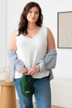 Experience style and comfort with our Plus Size Sleeveless V-Neck Sweater Top. Made from high-quality materials, this top is designed to flatter your figure while keeping you cool and comfortable. Perfect for any occasion, this top is a must-have for any plus size wardrobe. Get yours today! 🖤 Complete the look: Pair with denim shorts and flat sandals for a chic summer outfit. Add a long cardigan and snickers for a stylish, layered look. Dress it up with heeled mules and midi denim skirt for a more polished ensemble. 🖤 Features: women plus spring-fall sweater Tank, knit, three solid colors, sleeveless, relax fit, deep v-neckline, comfy tank is perfect for any occasion!