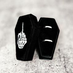 Get ready for the spookiest season with our Gothic Velvet Coffin Ring Box! Whether you're a Halloween enthusiast or just love all things spooky, this unique coffin-shaped box is perfect for showing off your favorite rings in style. RINGS NOT INCLUDED. Coffin Chic: Crafted from luxurious black velvet, this coffin ring box is both elegant and eerie, making it a standout piece in your jewelry collection. Double Trouble: With slots for TWO rings, this box is perfect for showcasing your beloved pair— Selling Rings, Skeleton Middle Finger, Coffin Jewelry, Coffin Ring, Finger Design, Gold Skies, Gothic Glam, Spooky Style, Forever Rose