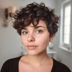 Curly Pixie with Rounded Shape Curly Pixie Haircut Round Face, Round Face Curly Pixie Haircut, Pixie Haircut For Curly Hair Natural Round Face, Short Curly Pixie Round Face, Curly Pixie Cuts Round Face Curls, Wavy Pixie Cut Round Face, Pixie Cut Curly Hair Round Face