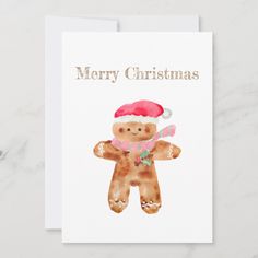 a christmas card with a watercolor teddy bear wearing a santa hat and holding a candy cane