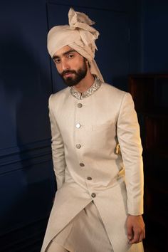 Sharp Chevron Sherwani Set - Contrast by Parth Chevron patterned achkan in shades of ivory and silver, collar embedded with glass beads and sequins. Included in purchase: Kurta and Pants Product Specification Color: Off-White (can be customized) Fabric: geometric silk jacquard Occasion: Formal Event, Wedding, Bridal, Reception Style: Sherwani Designer: Contrast by Parth Care: Dry Clean Only Work: Hand Embroidered ( Variation in color, fabric & detail is possible. Model images are only representa Cream Sherwani, Kurta And Pants, Sherwani For Men, Indian Wedding Wear, White Patches, Wear Store, Embroidered Collars, Nehru Jackets, Colored Wedding Dresses