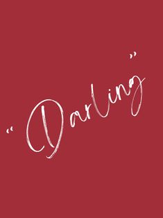 the word daring written in white ink on a red background