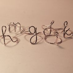 "initial ring - b initial ring - minimalist ring - personalized initial - bridesmaids - initial wire ring - silver initial ring - custom ringA tiny delicate cute little initial ring. Shown \"a,b,d,e,h,m,g,j,k i\" can make any initial you desire. Can make any letter lower case only for this add. Adorable flower girl gift or perfect mid knuckle ring. Comes in a little white organza bag. Please indicate what initial at checkout in note to seller. Thank you! Enter my shop: https://www.etsy.com/shop/ Silver Initial Ring, B Initial, Knuckle Ring, Wire Ring, Flower Girl Gifts, Knuckle Rings, Initial Ring, Custom Ring, Lower Case