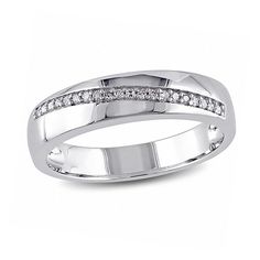 a white gold wedding band with channeled diamonds on the outside and in the middle