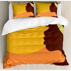 an orange and brown bed with two pillows