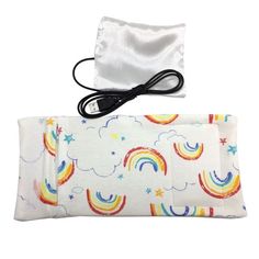 a white bag with rainbows and stars on it next to an electric charger