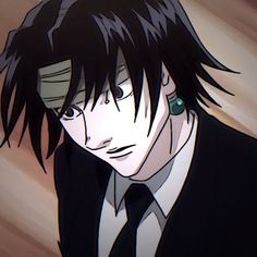 an anime character with black hair and green eyes wearing a suit, looking at the camera