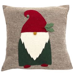 a christmas pillow with an image of a gnome on it