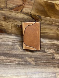 This is my Montana Western vertical wallet. My best seller it is shown in Chestnut and Tan 2 Toned. It measures 3.125 x 4.625 Closed Leather. Being a natural material, the shade of leather will vary with every wallet made. Brown Rectangular Trifold Wallet With Coin Pocket, Brown Trifold Wallets For Daily Use, Brown Trifold Card Holder For Everyday Use, Rustic Brown Leather Wallets, Beige Leather Rectangular Card Holder, Rectangular Beige Leather Card Holder, Brown Bifold Card Holder For Daily Use, Artisan Brown Wallets With Interior Card Slots, Artisan Brown Wallet With Interior Card Slots