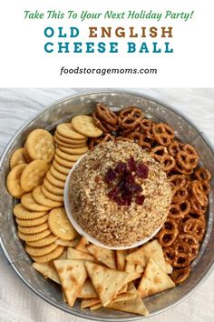 a bowl filled with crackers and pretzels on top of a white table