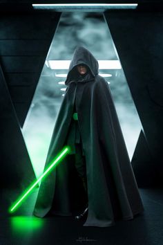 darth vader standing in front of a green light