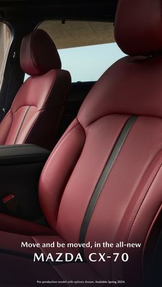 the interior of a car with red leather and black stitching on the front seats