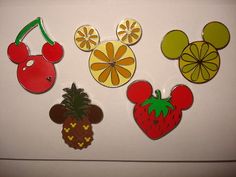 mickey mouse and friends fruit magnets on a refrigerator