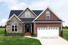 a large brick house in the middle of a green field