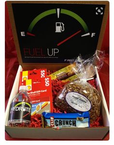 the fuel up gift box is packed with snacks, candy, and other goodies