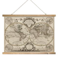 an old world map hanging on a wall