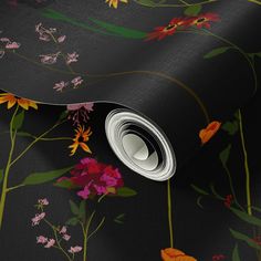 a black floral wallpaper with pink, yellow and red flowers on the bottom half