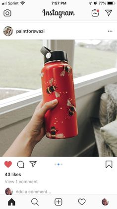 someone holding up a red instagramr with bees on it and the caption says,