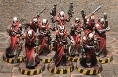 a group of painted warhammers standing on top of a table